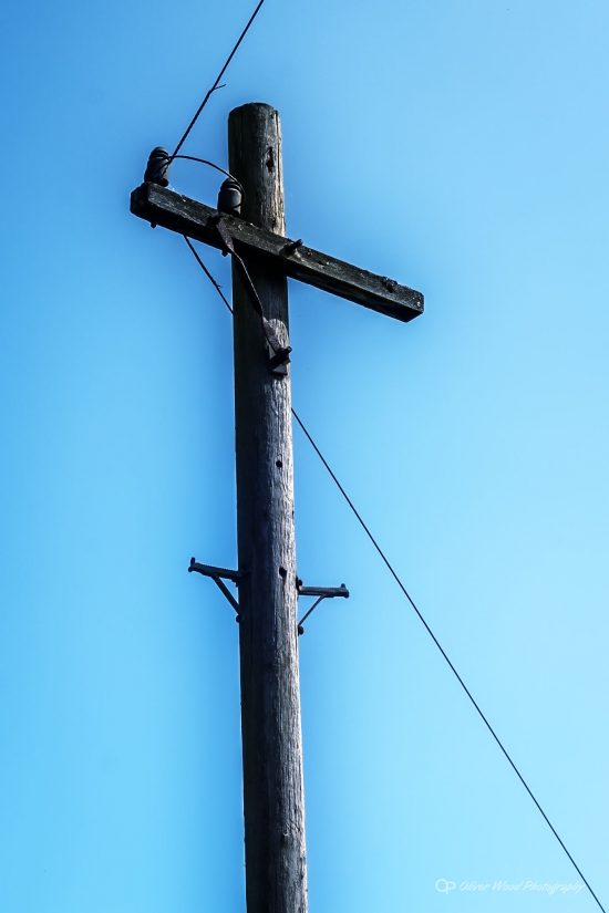 telegraph pole against sky with orton filter