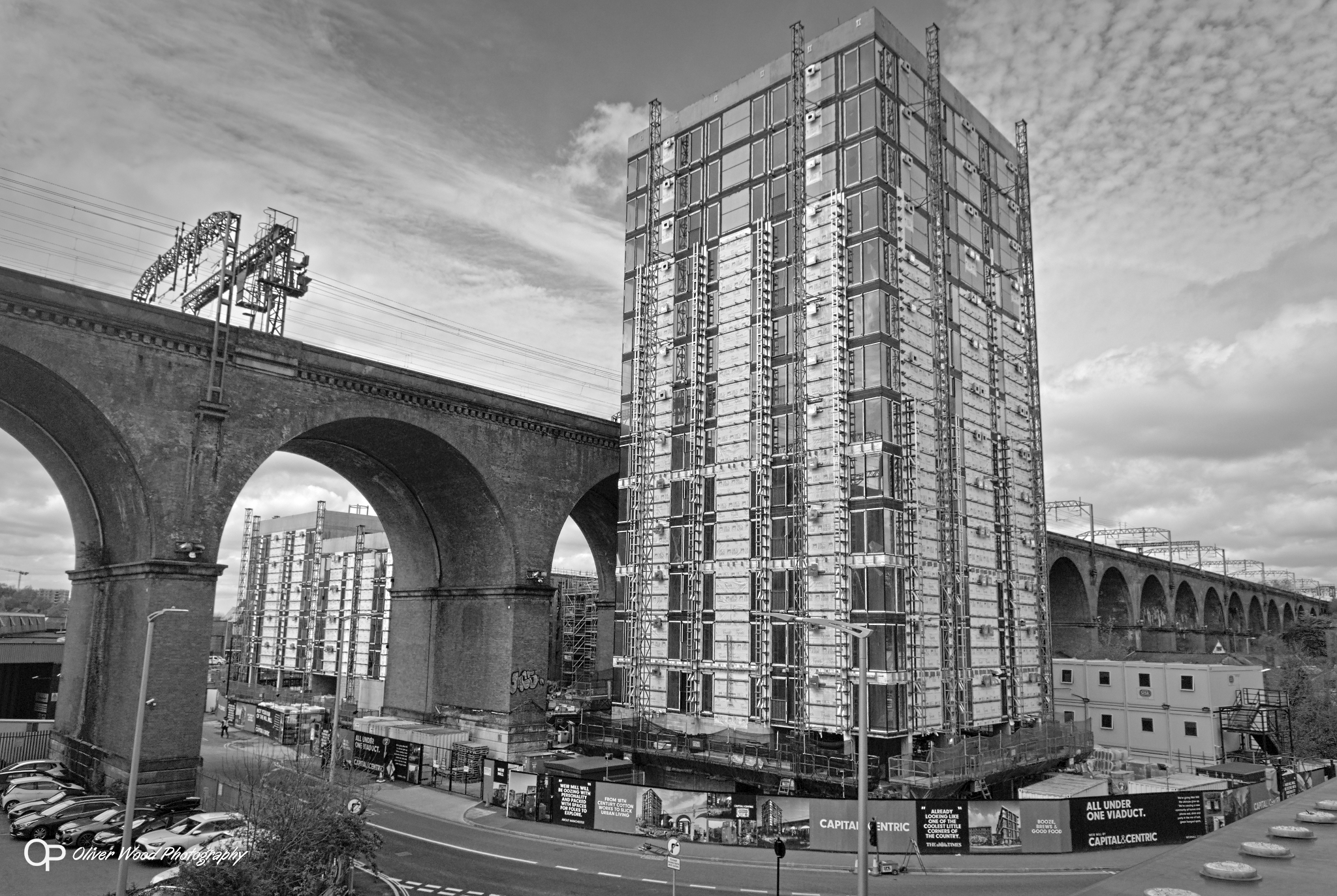 Black and white photo of new tower block and railway viaduct