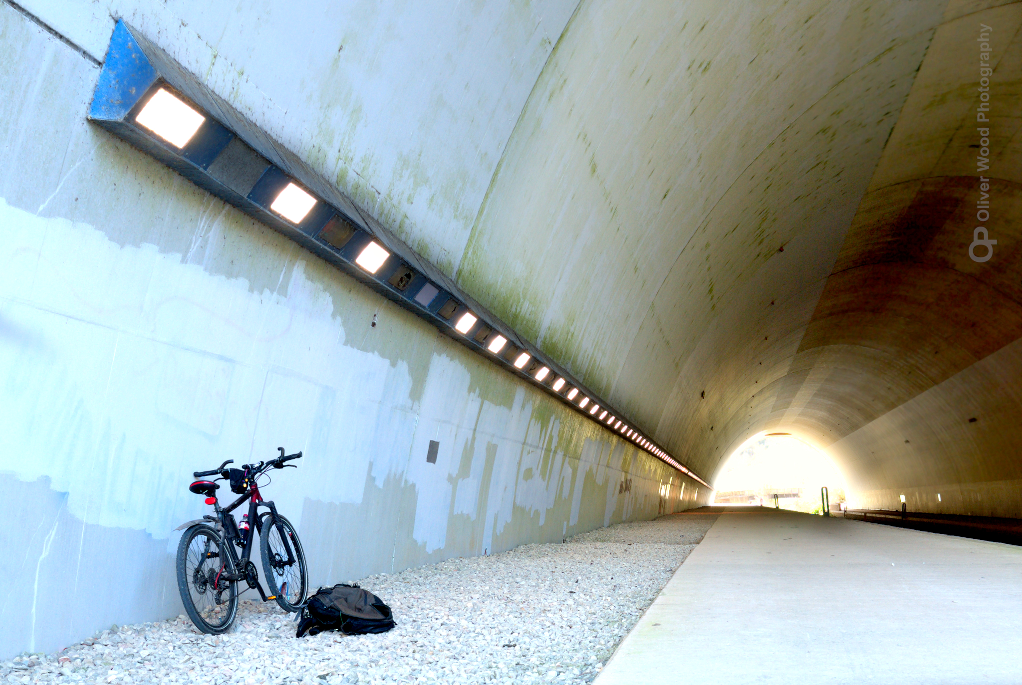 A large tunnel with lights and a mountain bike.