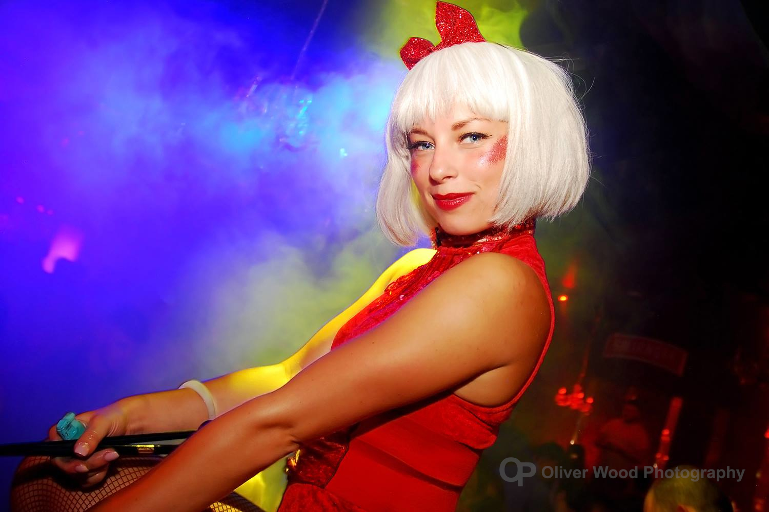 Vivid night club dancer with blue and yellow diffused background. 