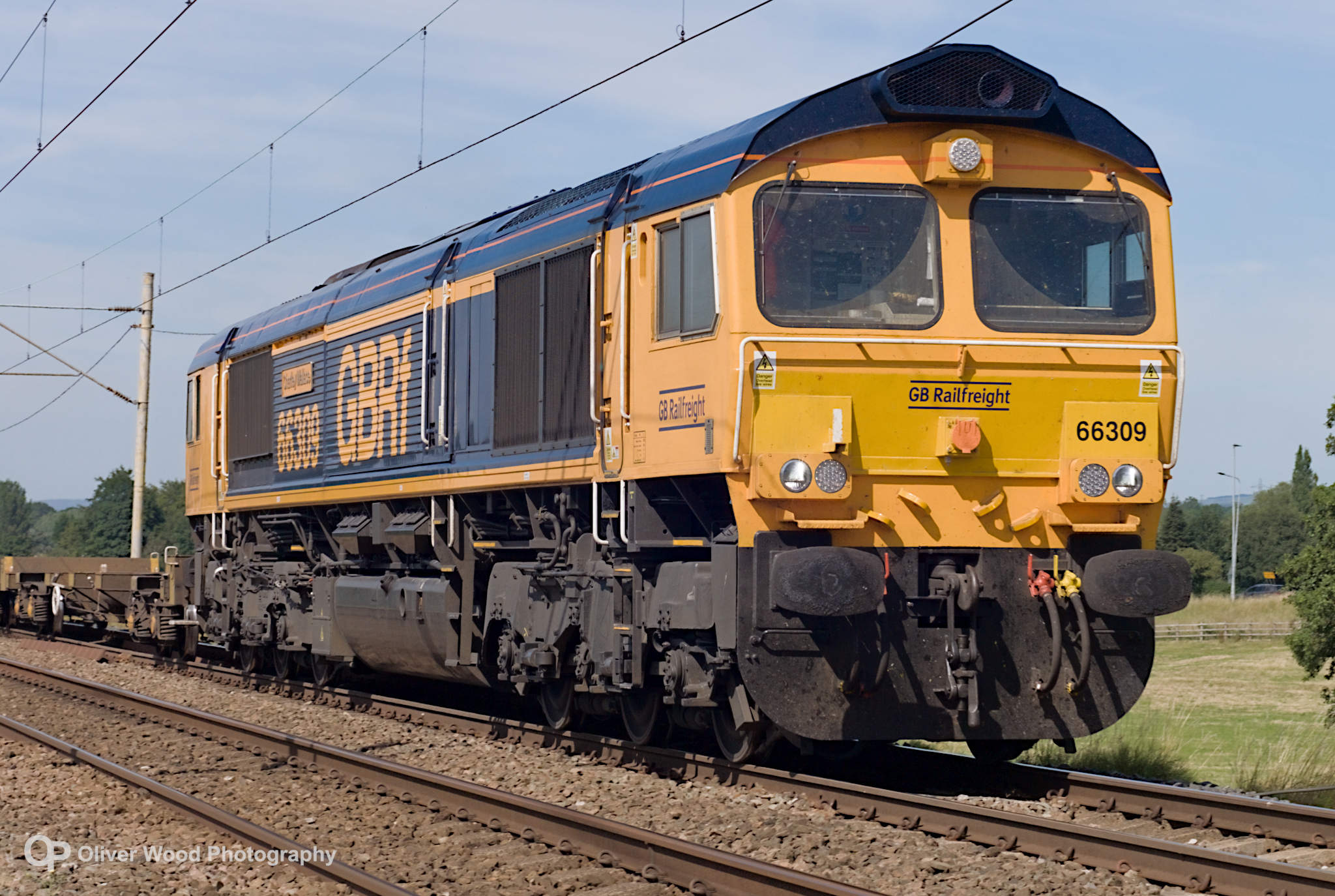 Close up of a passing class 66 freight locomotive